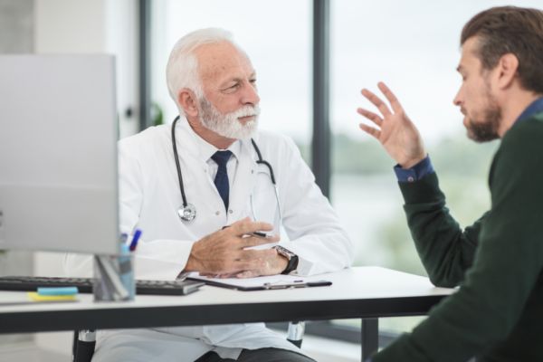 Doctor speaking with a patient during a consultation